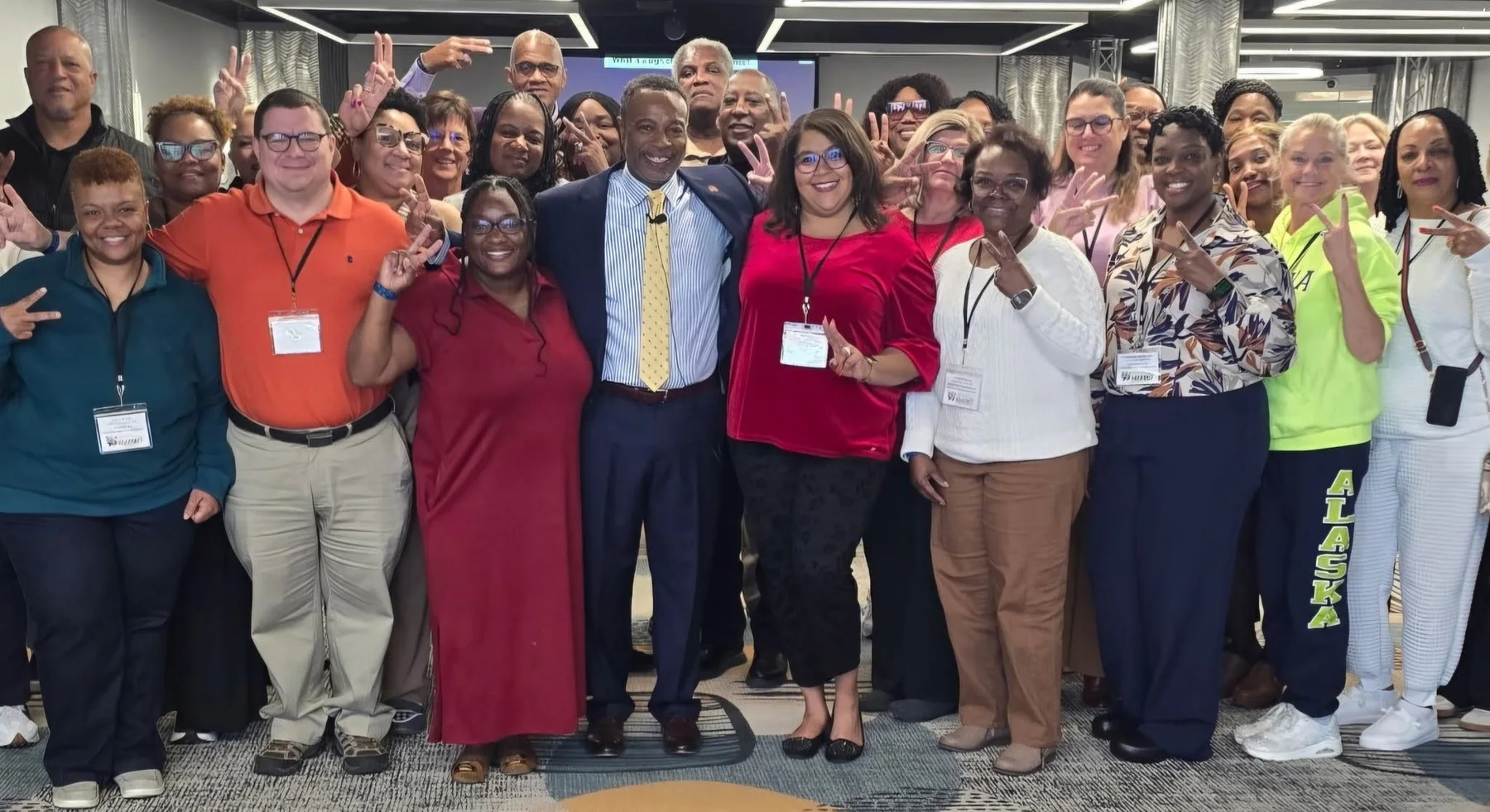 Bobby Collins posing with a group of housing professionals